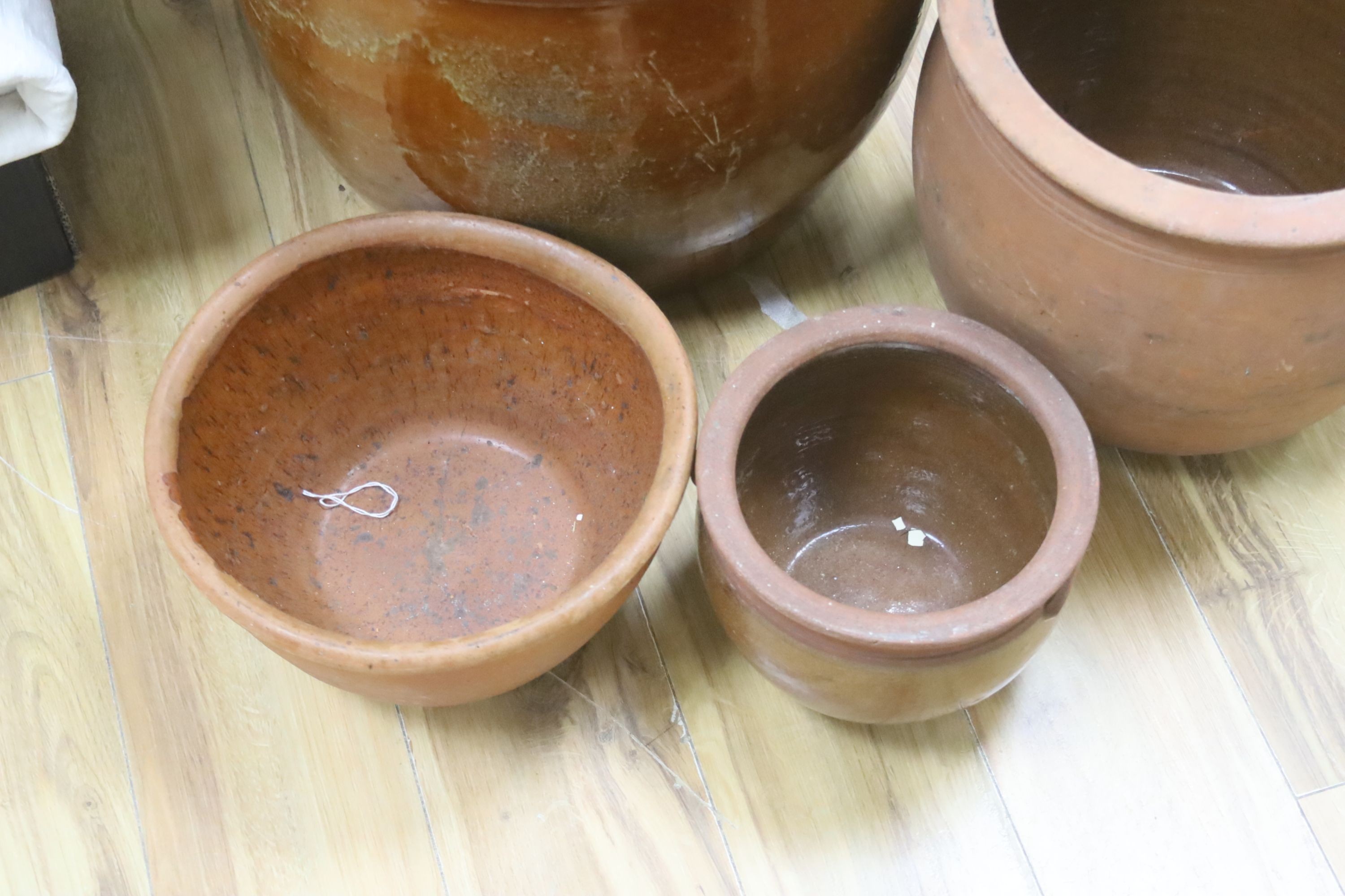 Four Sussex terracotta pots, tallest 40cm